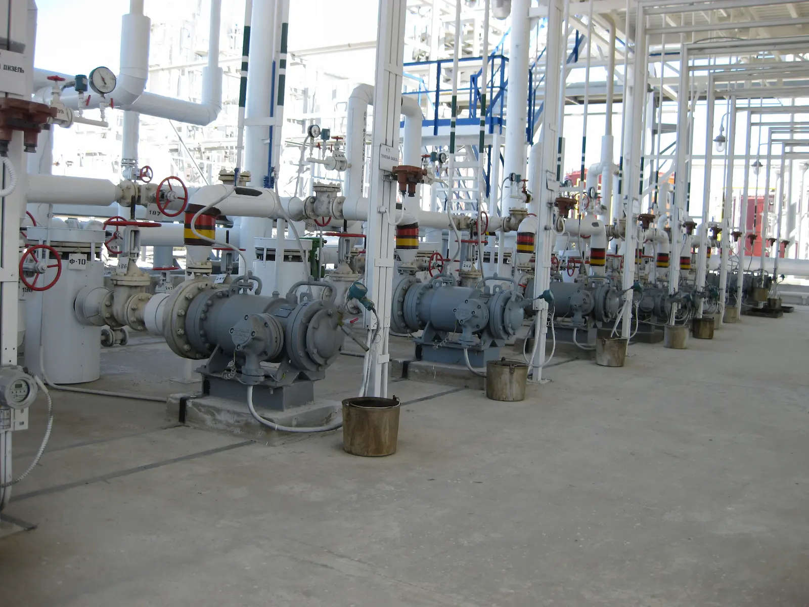 A plant room interior with chilled water pipework, valves and pumps