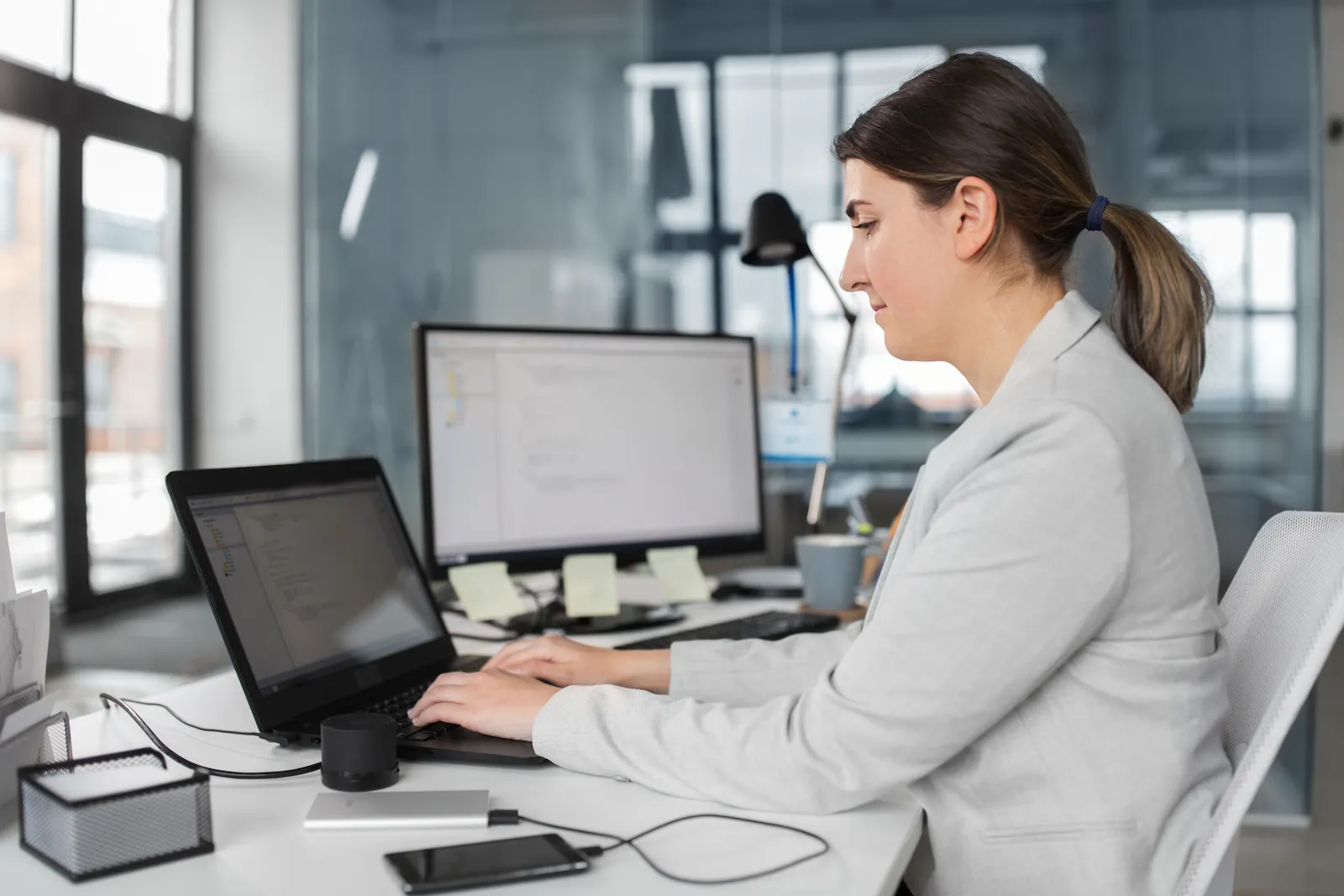 An engineer at a workstation working through a library of standardised building components