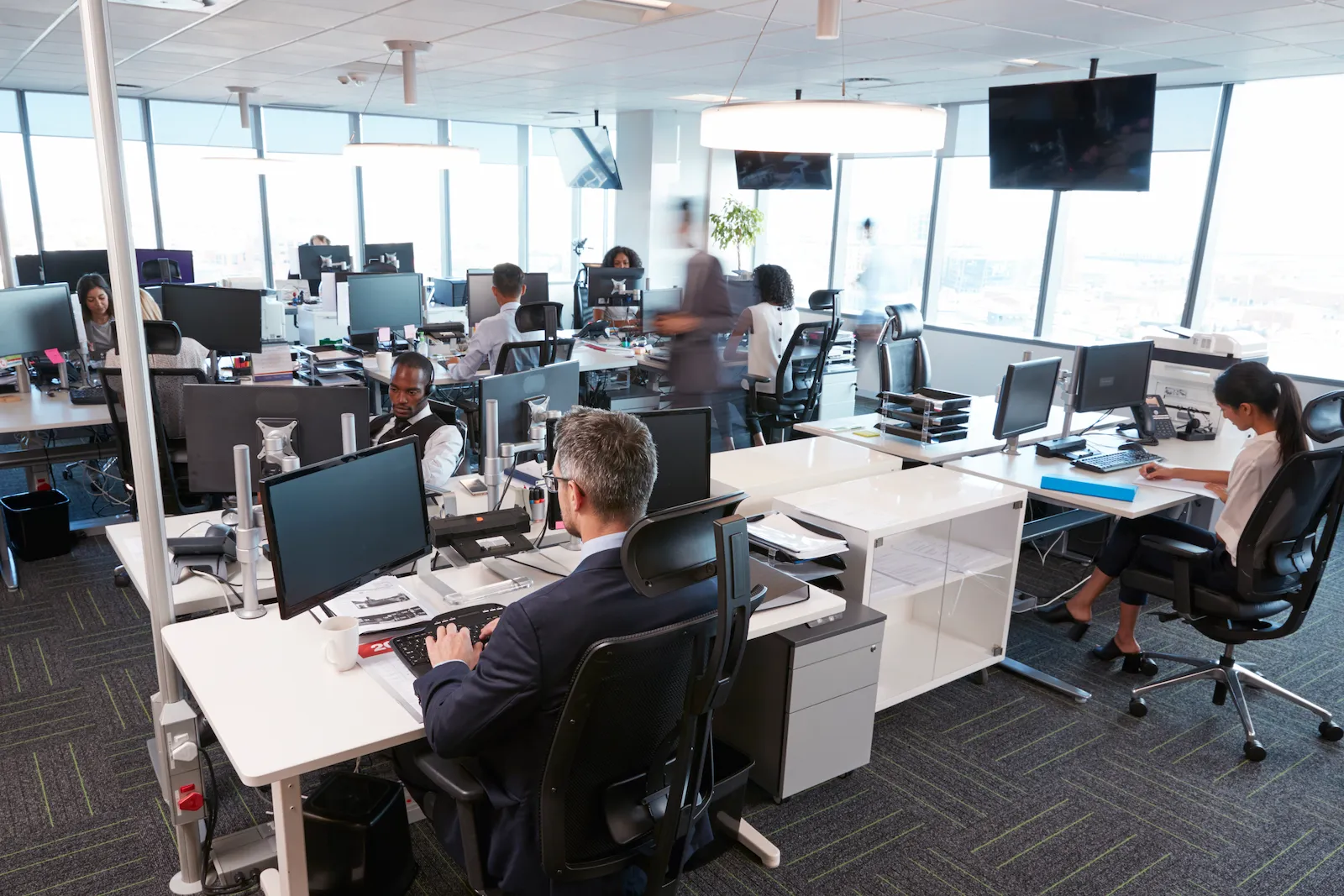 An operations centre with engineering data on a large wall display